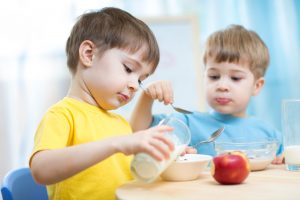 42593617 - children eating healthy food in kindergarten or nursery